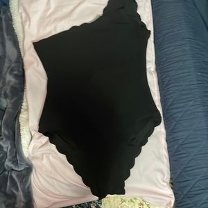 Black medium one piece Shein one shoulder strap bathing suit. Scalloped edges.